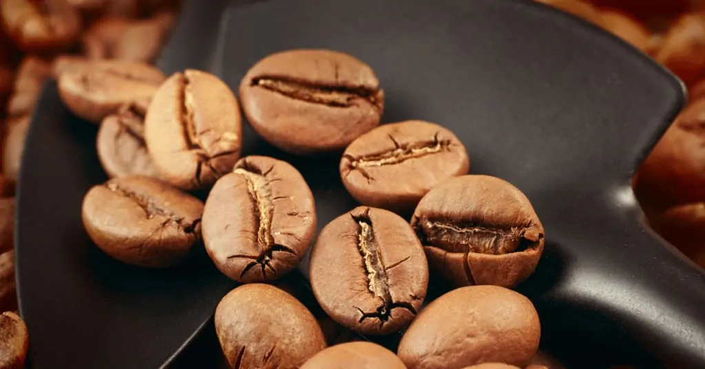 coffee beans in a home coffee roaster roasting