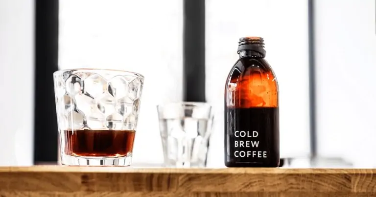 cold brew concentrate in a bottle and a glass