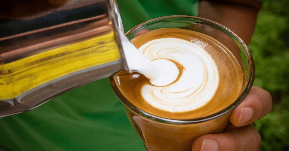 person making a latte