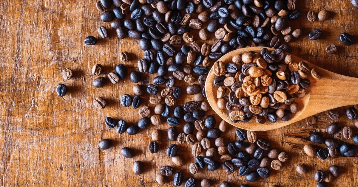 different types of coffee roasts on a wooden table