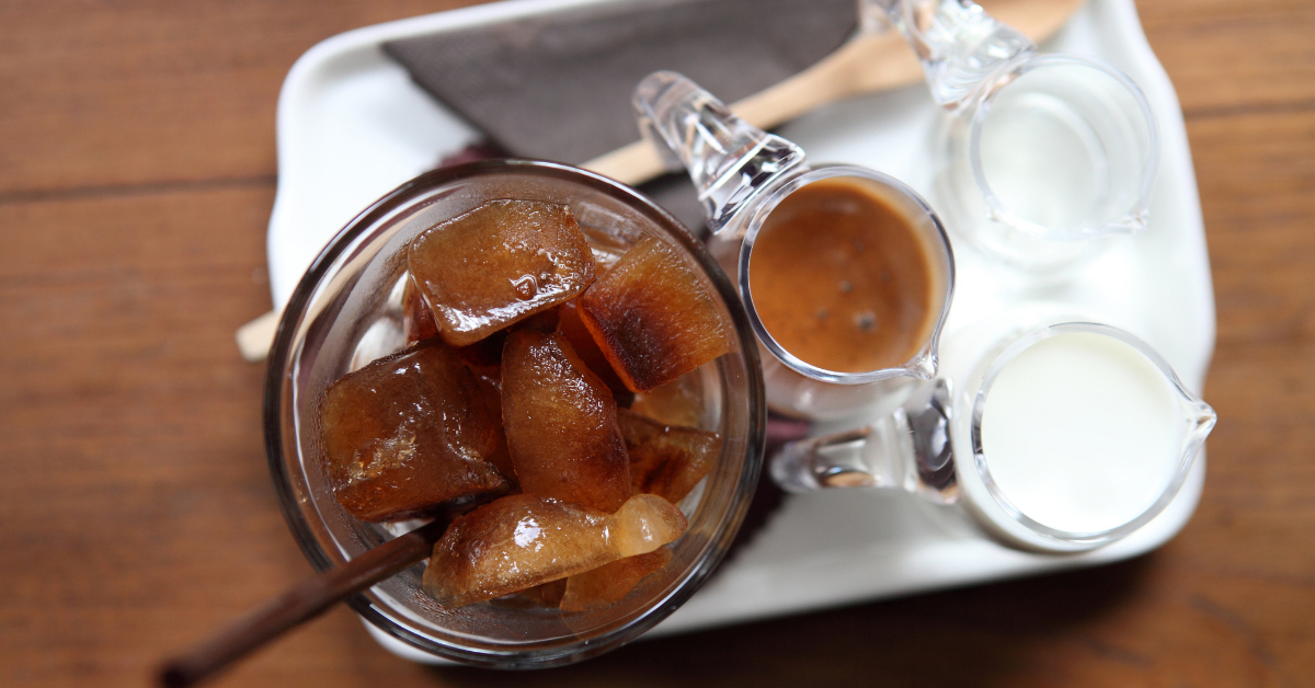 served ingredients for iced latte coffee