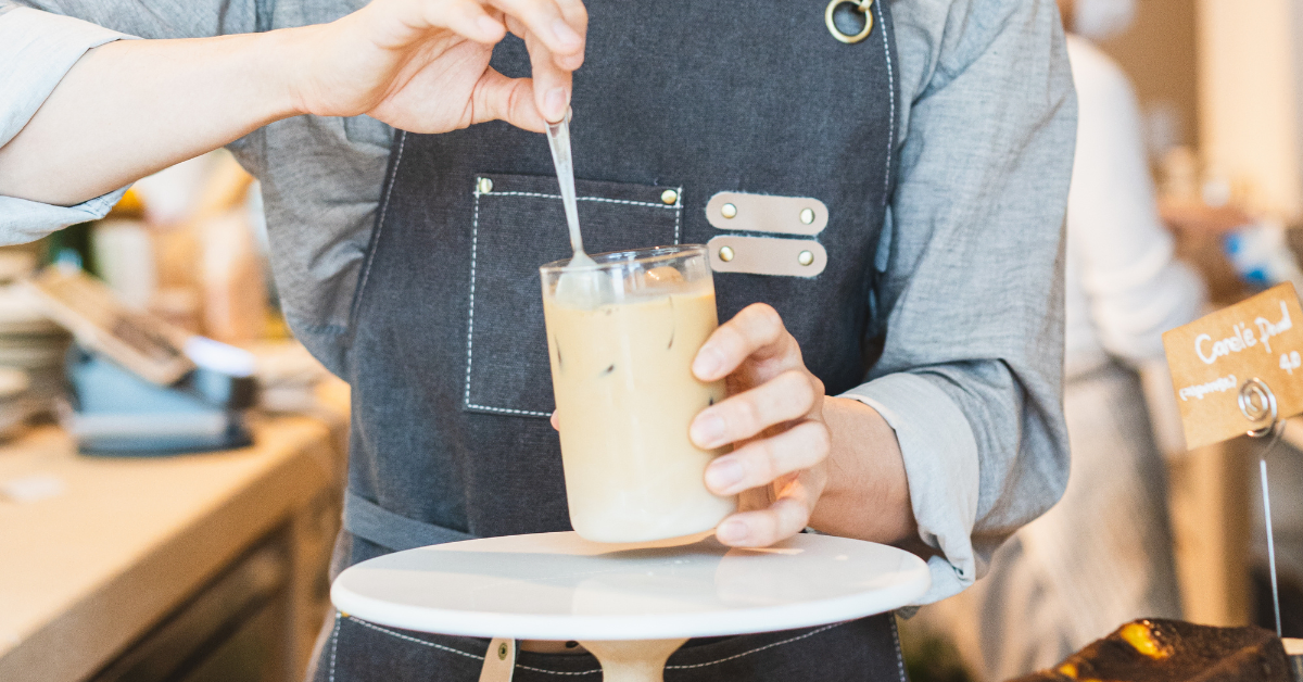 barista making iced blonde vanilla lattee