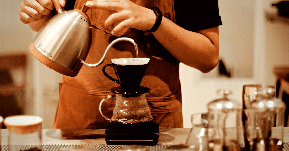 barista making v60 coffee