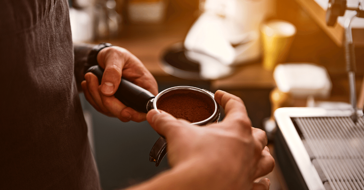 barista holding portafilter