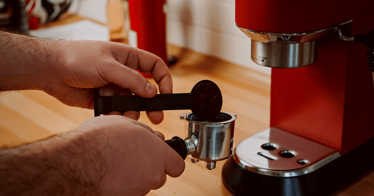 man using espresso machine