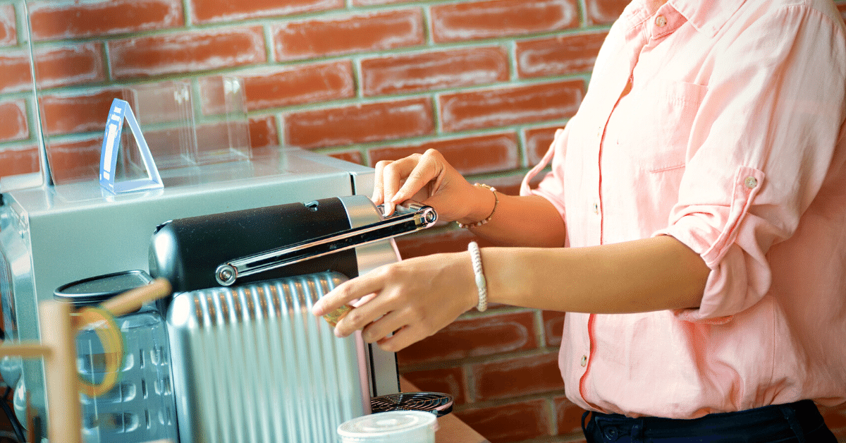 woman using coffee maker