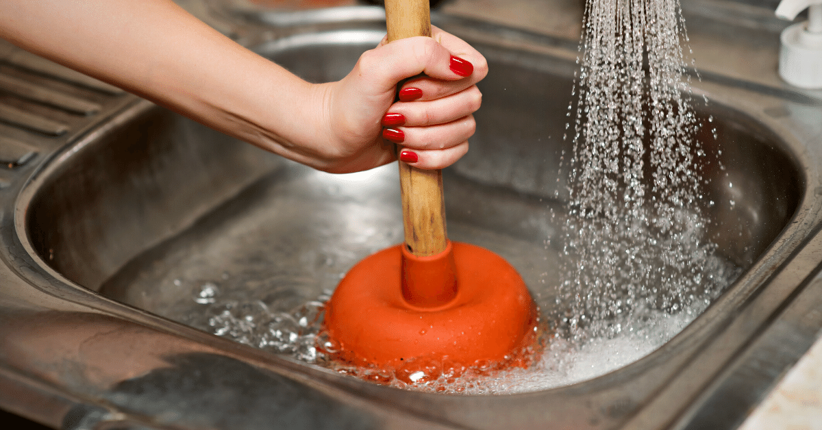 woman using plunger