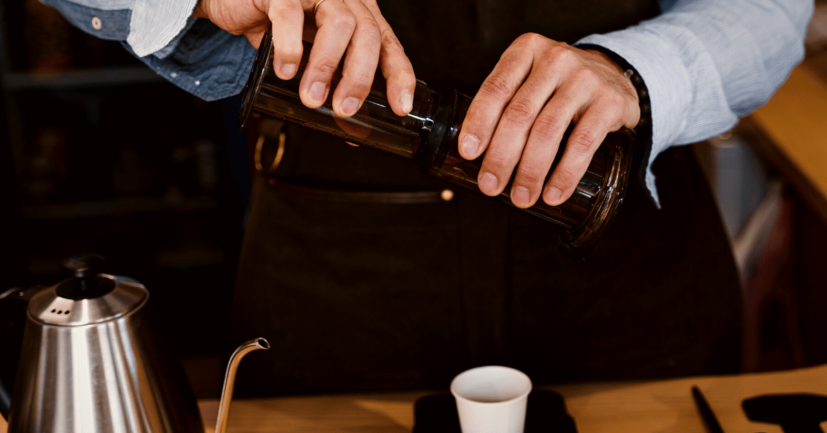 man using aeropress