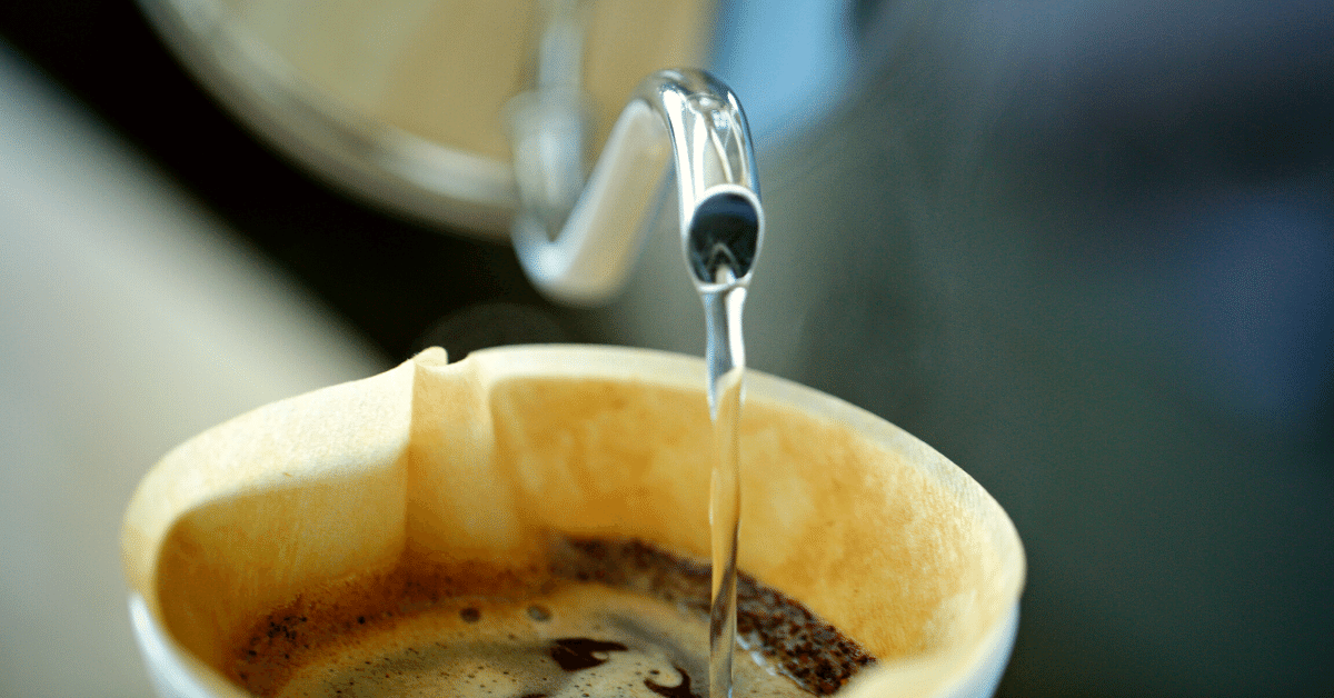 pouring hot water over coffee